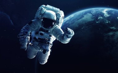 Astronaut in front of the Earth planet. Elements of this image furnished by NASA clipart