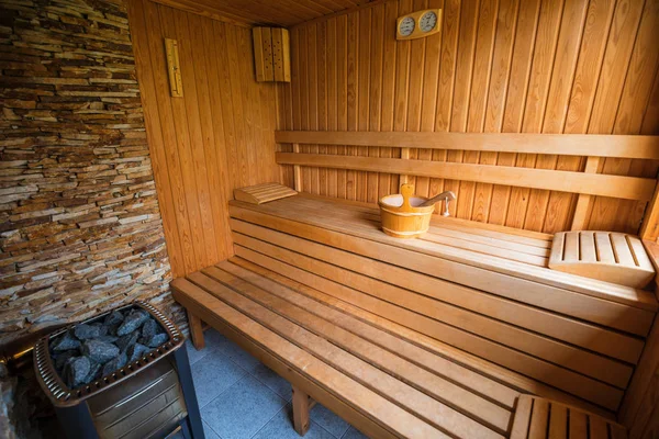 Empty sauna room with traditional sauna accessories