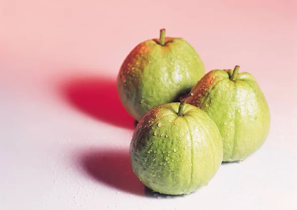 three apples on white background