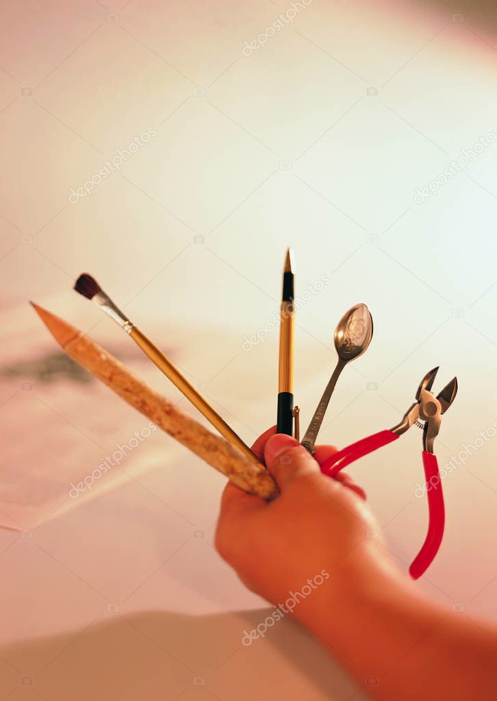 Closeup of person hand holding tools