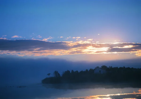 beautiful view of foggy lake at dawn
