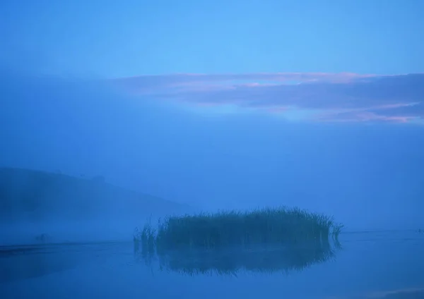 beautiful view of foggy lake