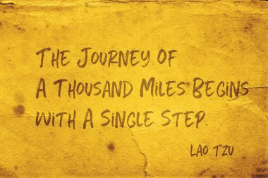 The journey of a thousand miles begins with a single step - ancient Chinese philosopher Lao Tzu quote printed on grunge yellow paper clipart