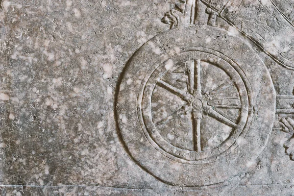 Ancient wheel relief — Stock Photo, Image