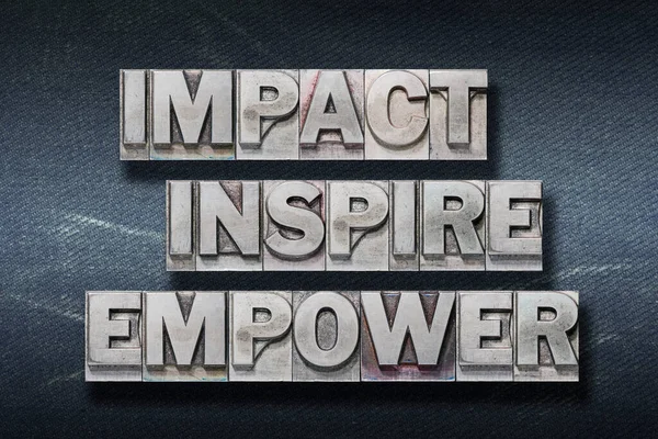 Impact Inspire Empower Words Made Metallic Letterpress Dark Jeans Background — Stock Photo, Image