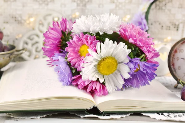 Bunch Beautiful Colorful Chinese Asters Lying Opened Book Table — Stock Photo, Image