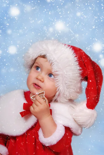 Little Girl Santa Hat Eating Gingerbread Cookie Christmas Snowy Day — Stock Photo, Image