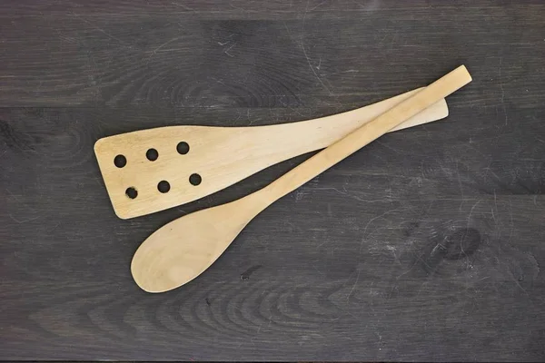 A studio photo of wooden kitchen utensils