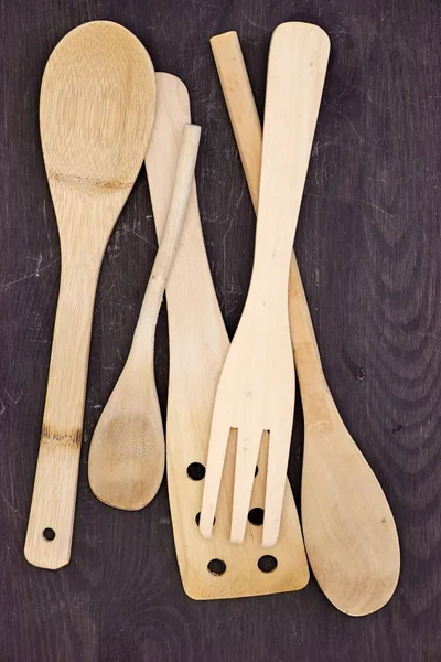 A studio photo of wooden kitchen utensils