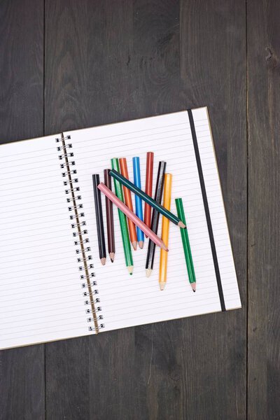 A studio photo of a note book pad