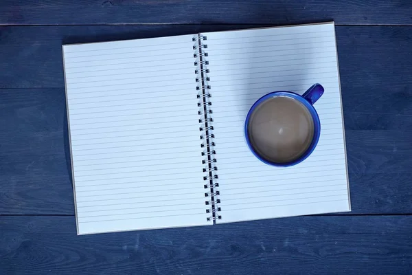 A studio photo of a note book pad