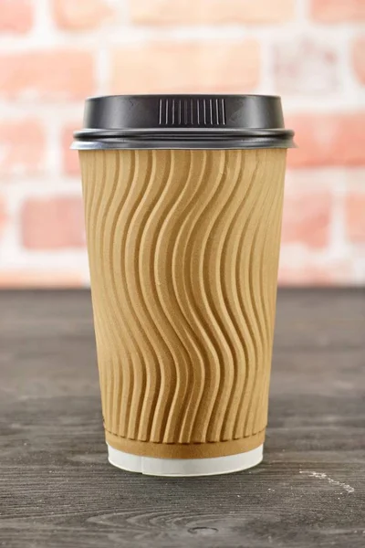 A studio photo of a takeaway coffee cup