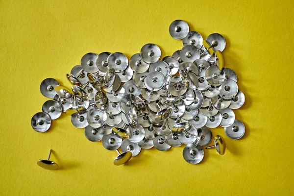 A studio photo of drawing pins