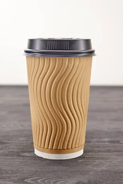 A studio photo of a takeaway coffee cup