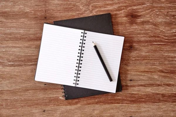 A studio photo of a blank note book