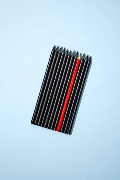 A studio photo of black pencils