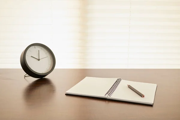 A studio photo of a desk clock