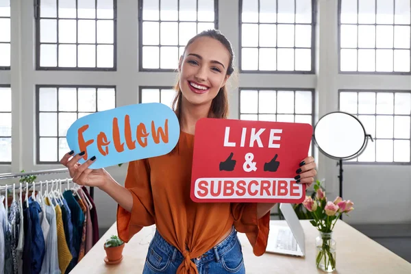 Female vlogger asking online audience to like and subscribe to channel
