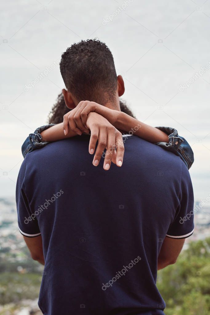 couple in love together hugging, back view