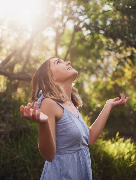 Carefree Woman Arms Out Enjoying Sunlight Forest Smiling Stock Picture