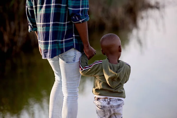 Father and son child holding hands backview — Stock Photo, Image