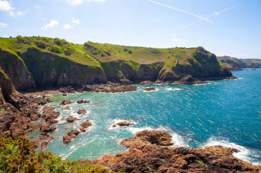 Cliffs of the Island of Jersey in the English Channel clipart