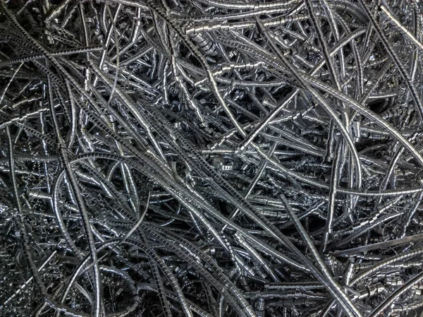 A hosszú, göndör alumíniumchipek mintázatát a szelektív fókusz — Stock Fotó