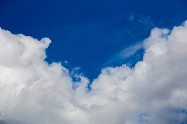 White cloud and blue sky at daylight. Close shot wit telephoto lens and polarizing filter with minimalistic composition