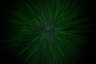 natural lens zoom explosion radial blurred green particles on black background with selective focus clipart