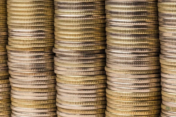Five equal stacks of coins merged in one solid wall macro background — Stock Photo, Image