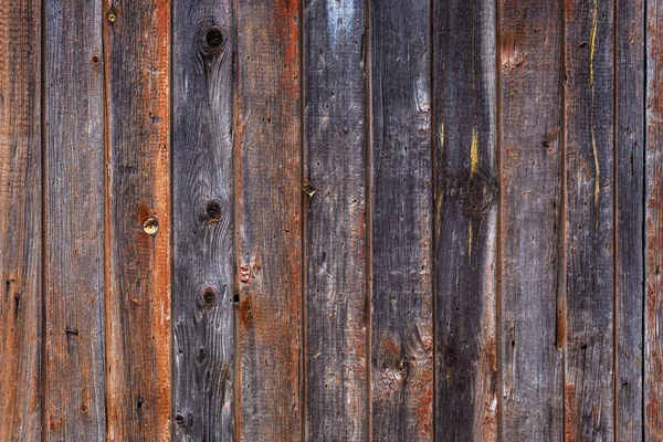 Artistic texture of an old wooden fence in black and brown tones - close-up rustic background — Stock Photo, Image