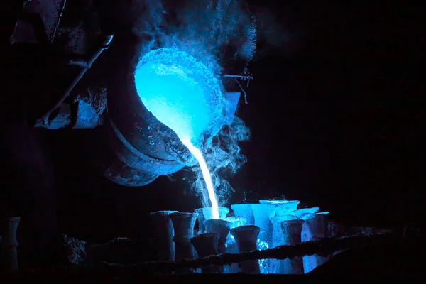 Steel casting process toned blue for magic potion or chemical or biohazard or radioactive waste illustration — Stock Photo, Image