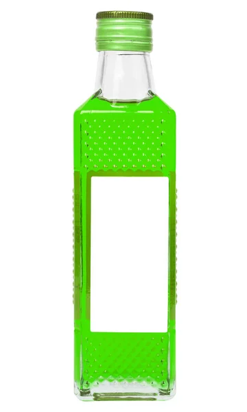 Pequena garrafa de vidro retangular com líquido verde ácido isolado no fundo branco — Fotografia de Stock
