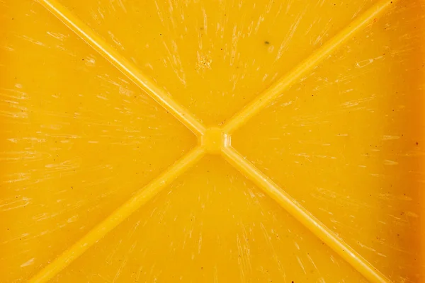 Γκρο πλαν υφή και φόντο από κίτρινο bakelite ή carbolite πλαστικό υλικό με το σχήμα x πλευρά ενίσχυση μούχλα — Φωτογραφία Αρχείου