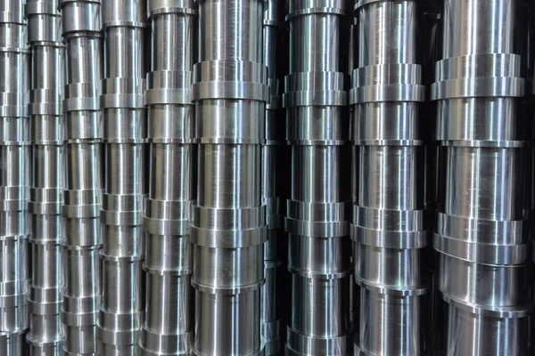 Abstract industrial shiny steel production stack full frame background with cnc machined pipes - selective focus and lens blur technique — Stock Photo, Image