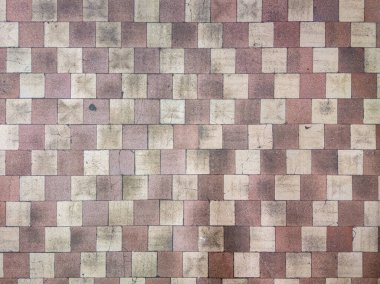 Worn checkerboard soviet tile floor in factory locker room - full-frame flat background and texture