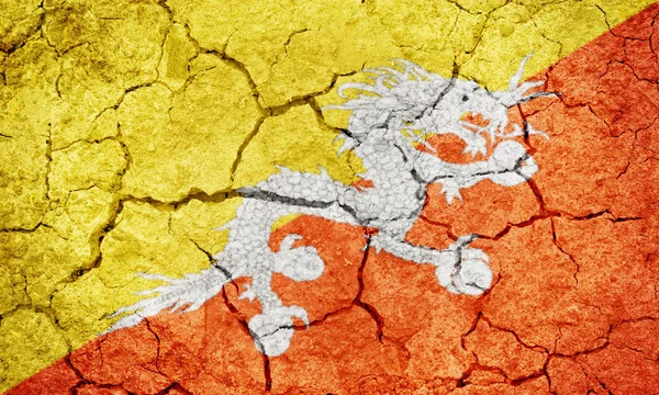 Kingdom Bhutan Flag Dry Earth Ground Texture Background — Stock Photo, Image