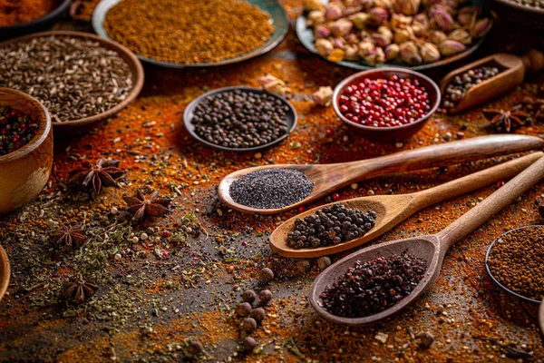 Colorful spices in wooden spoons Stock Image