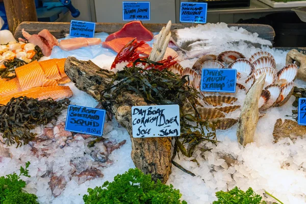 Fish, seafood and scallops for sale at a market in London, UK