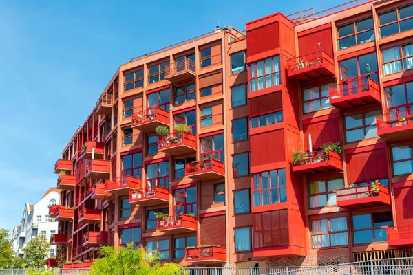 New red multi-family apartment house seen in Berlin, Germany