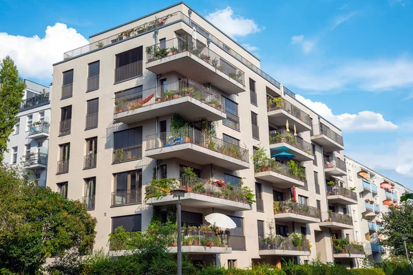 Gray modern multi-family house with balconies seen in Berlin, Germany