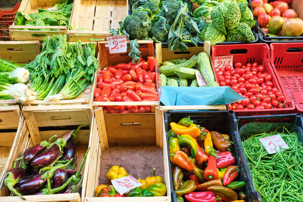 Different kinds of vegetables and salad for sale at a market in Naples, Italy