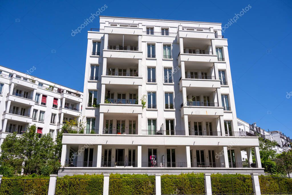 Modern white multi-family house seen in Berlin, Germany