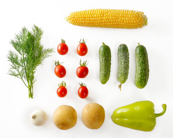 Eco-friendly products from garden. Carrots, onions, potatoes, dill, corn, pepper. Top view isolated vegetables. Healthy food.
