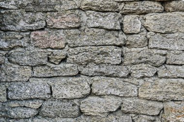 Karanlık duvarın dokusu doğal malzemeden yapılmıştır. Taş taşlama.