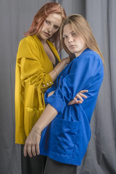 Two Cheerful Girls Colorful Jackets Dancing Having Fun — Stock Photo, Image