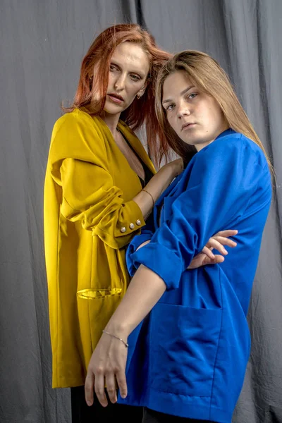 Two Cheerful Girls Colorful Jackets Dancing Having Fun — Stock Photo, Image