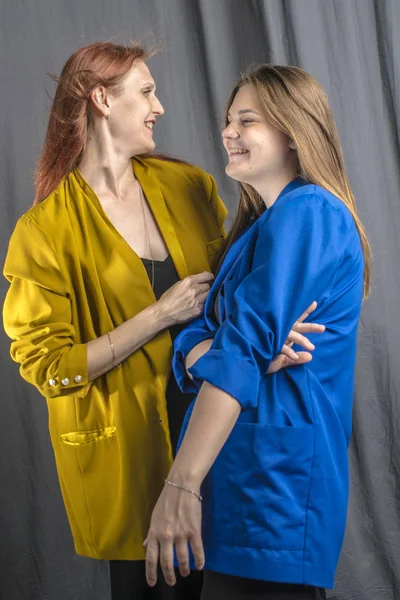 Two Cheerful Girls Colorful Jackets Dancing Having Fun — Stock Photo, Image