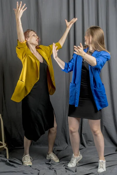 Two Cheerful Girls Colorful Jackets Dancing Having Fun — Stock Photo, Image