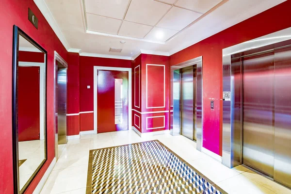 porch of a modern residential building with a hall and elevators